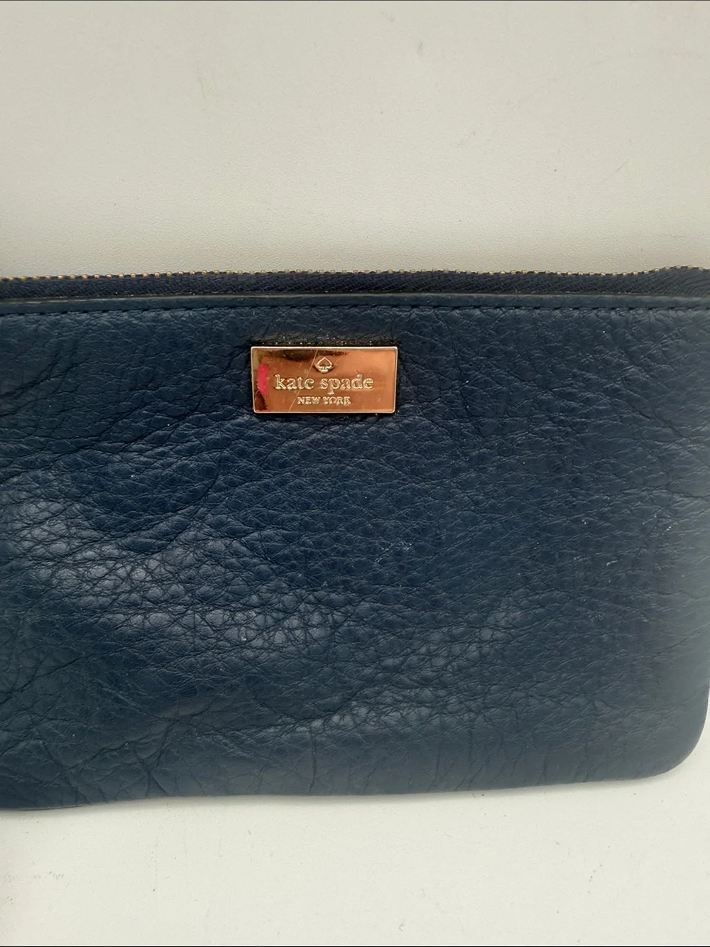 kate spade navy pebbled leather wristlet wi/  gold logo 6.5x4”